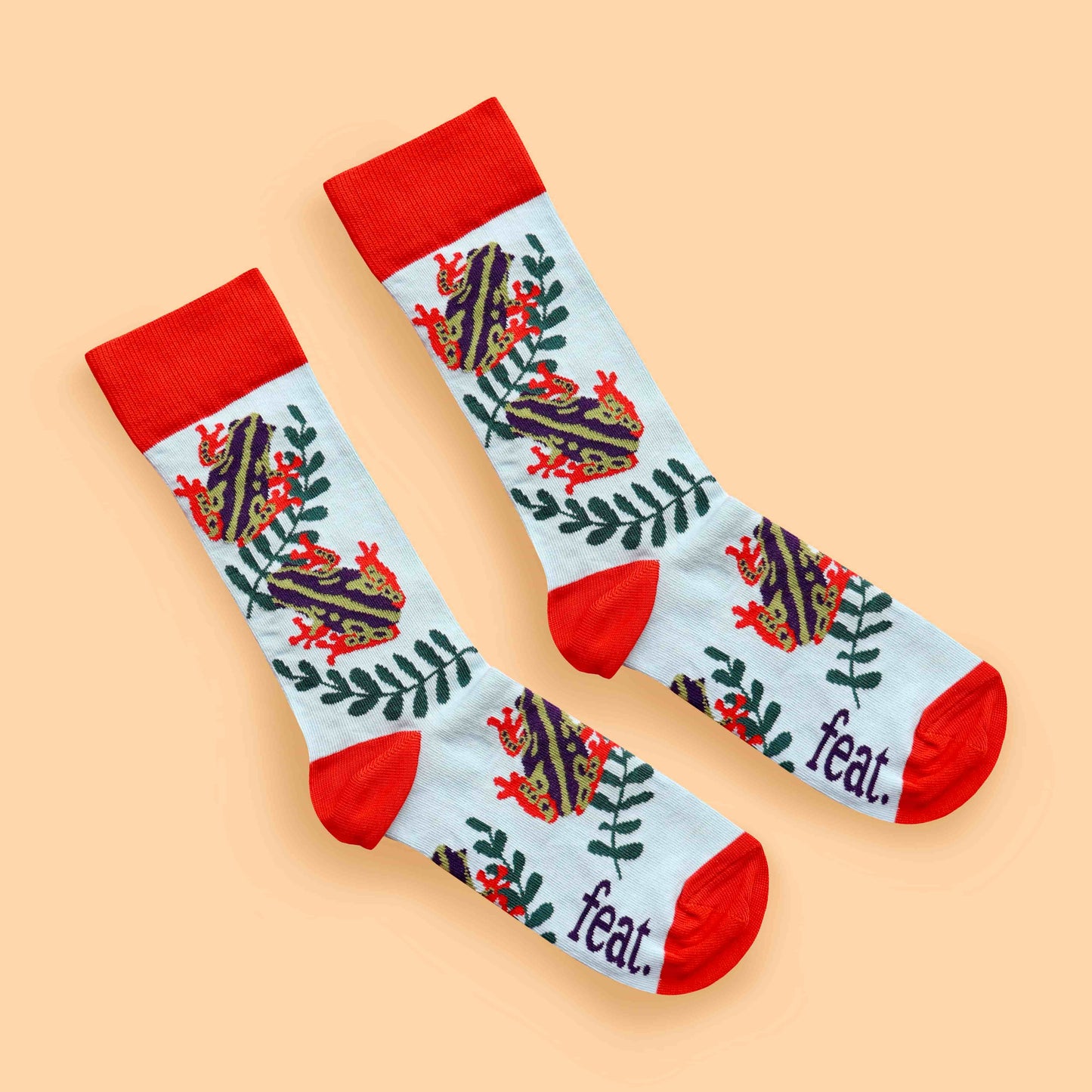 Reed frog socks peach background diagonal