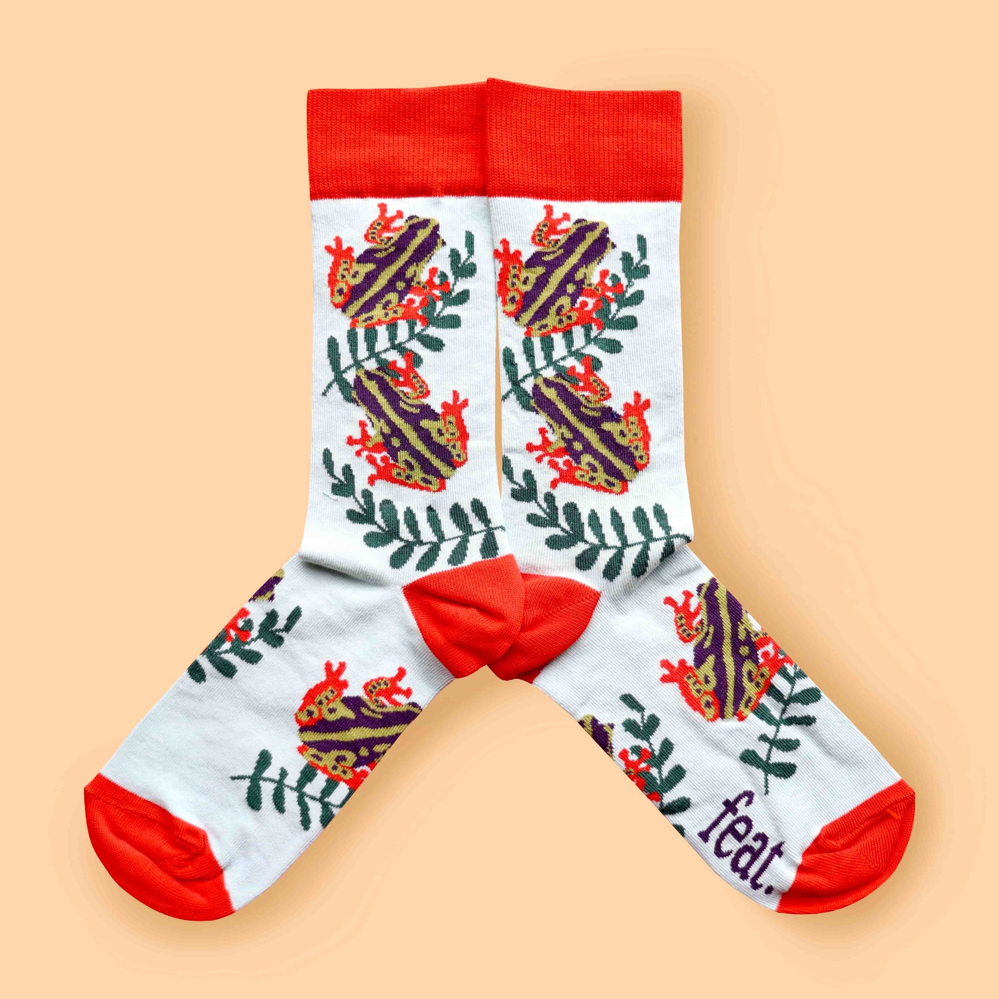 Reed frog socks peach background mirrored