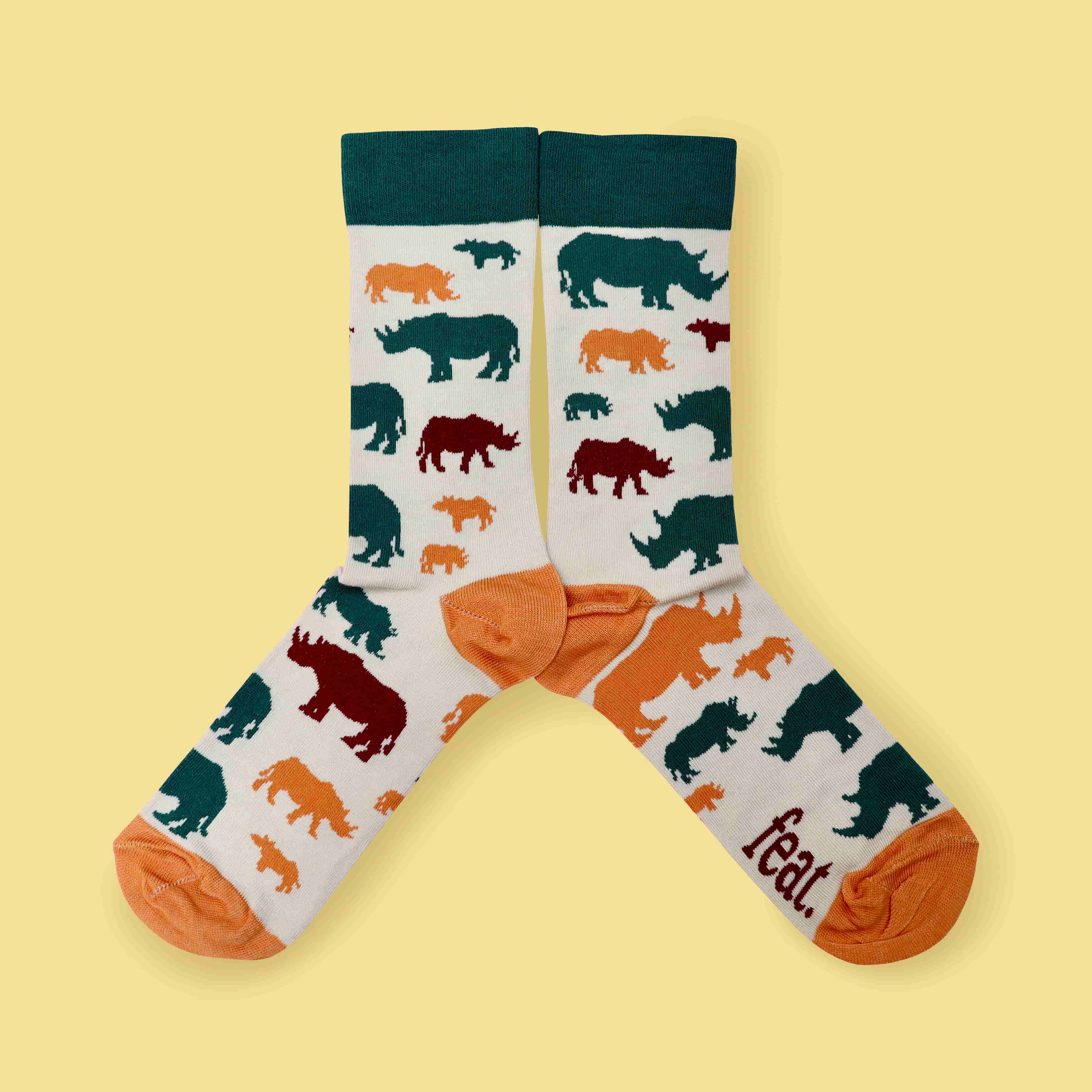 Milk and forest rhino socks yellow background centered