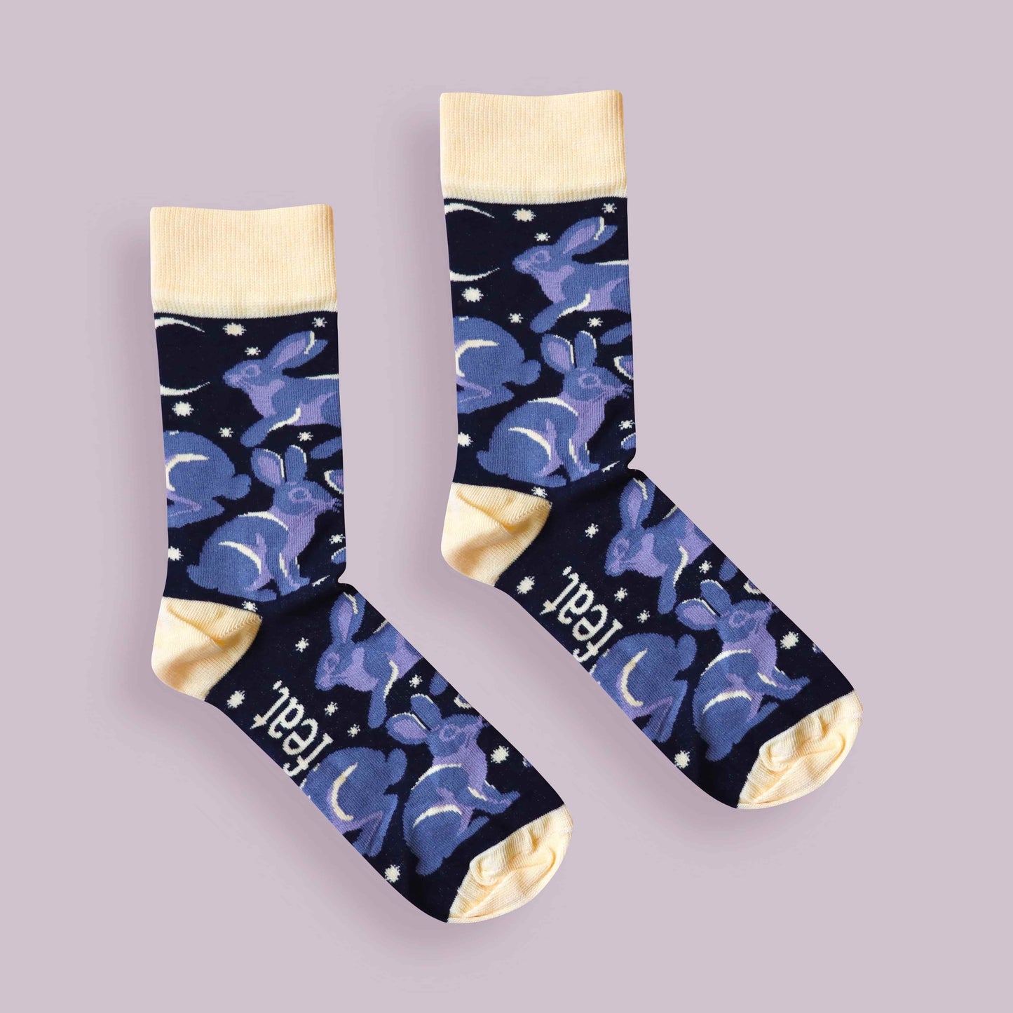 Riverine rabbit socks purple background centered