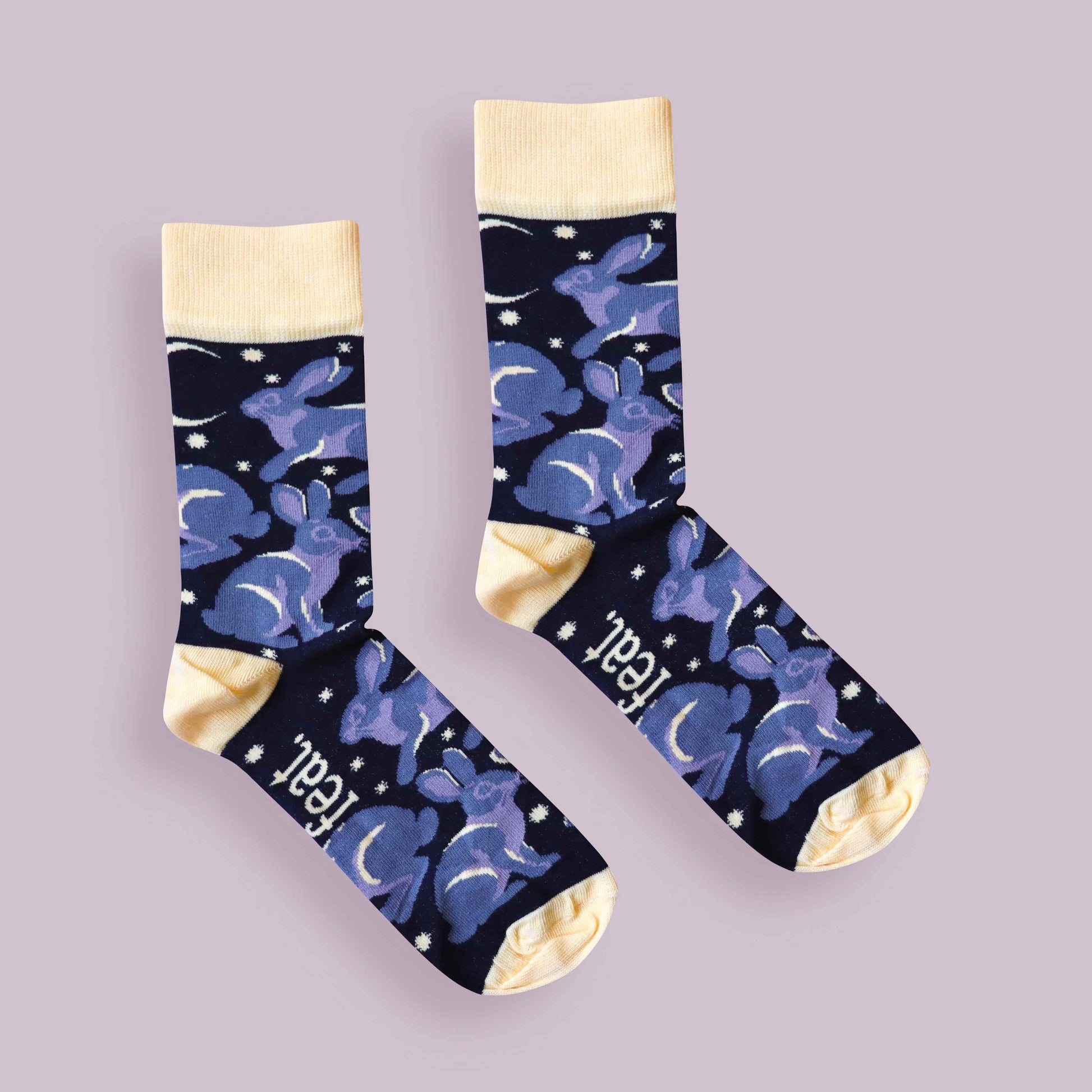 Riverine rabbit socks purple background centered