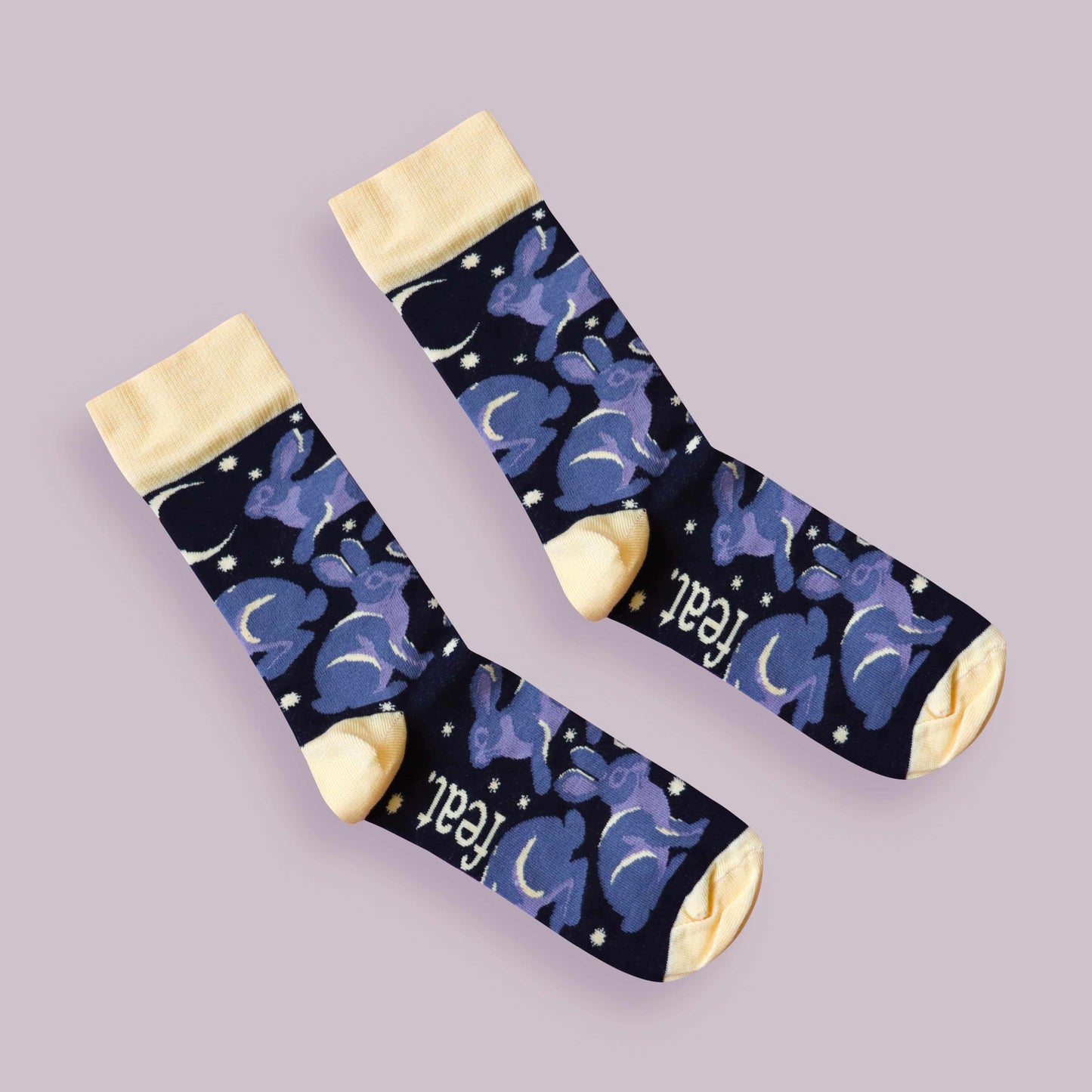 Riverine rabbit socks purple background diagonal