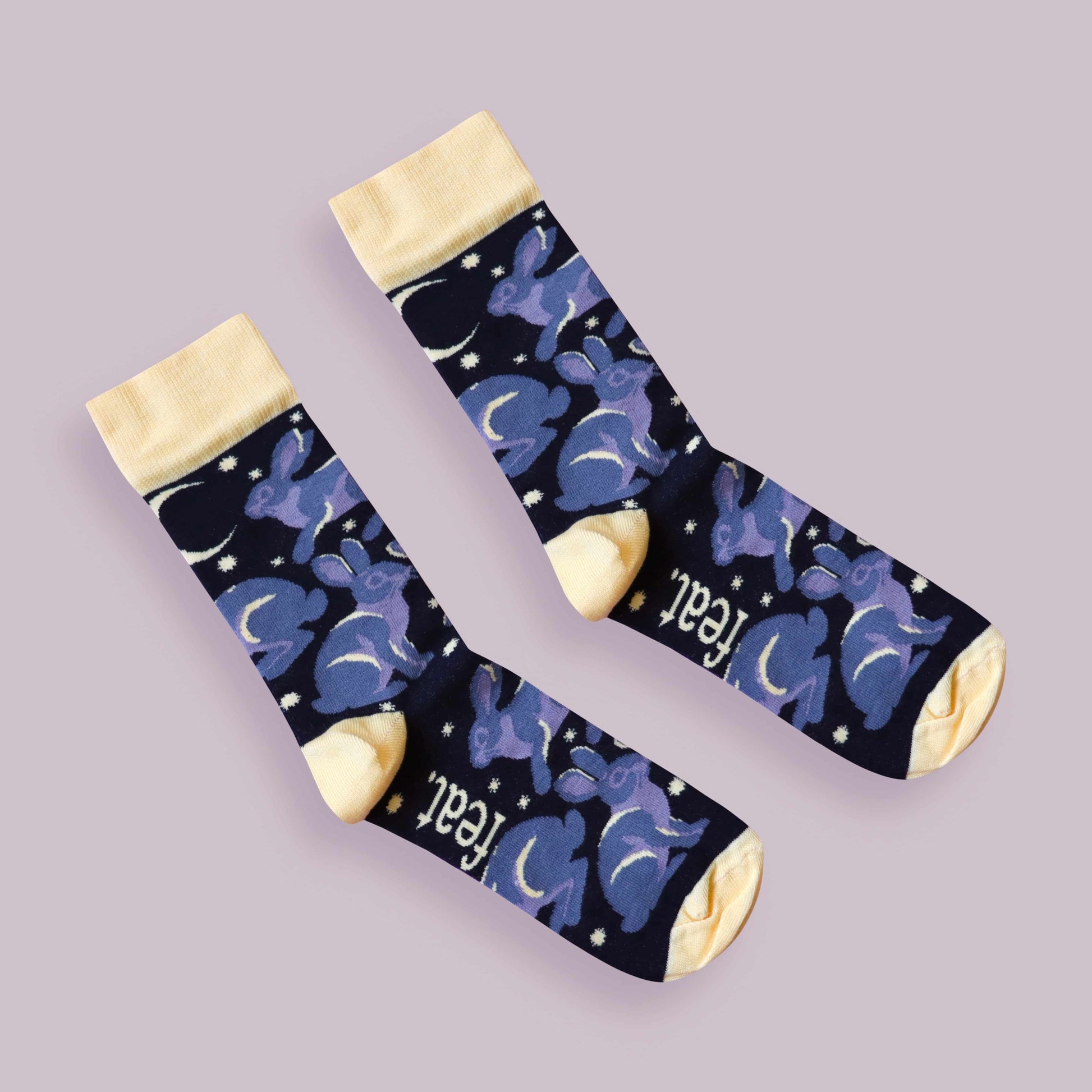 Riverine rabbit socks purple background diagonal