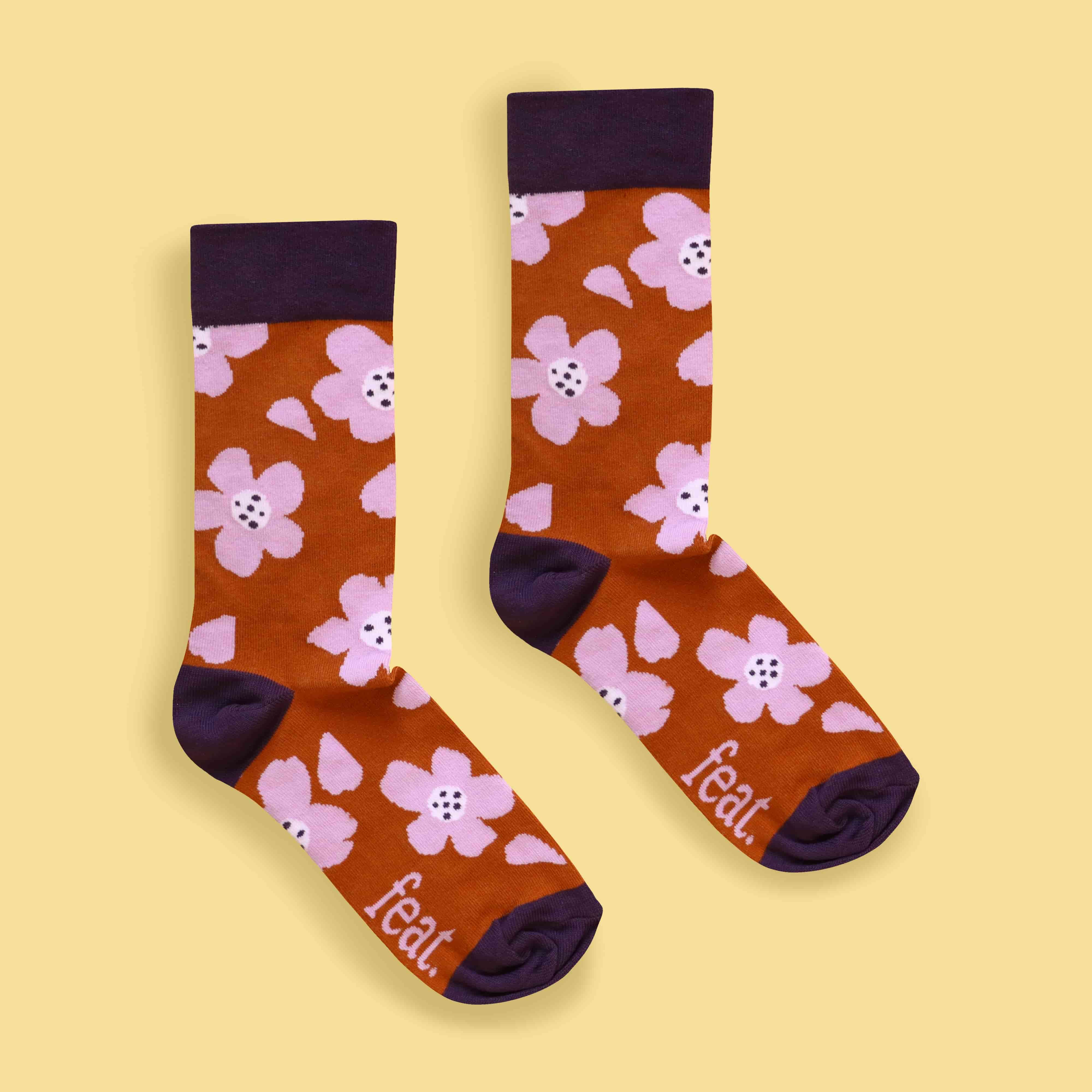Rust and lilac floral socks centred image yellow background