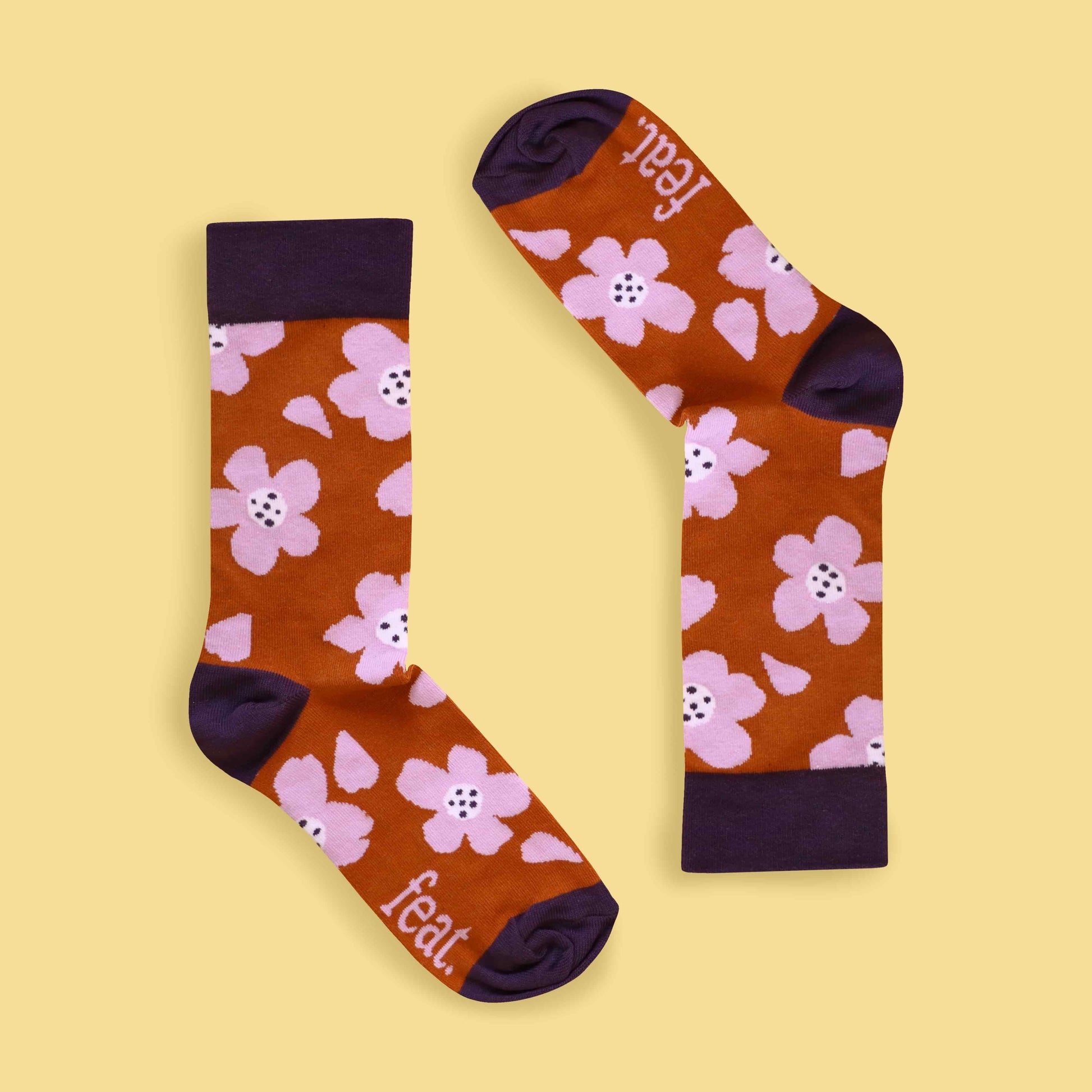 Rust and lilac floral socks inverted image yellow background