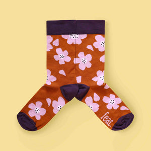 Rust and lilac floral socks mirror image yellow background