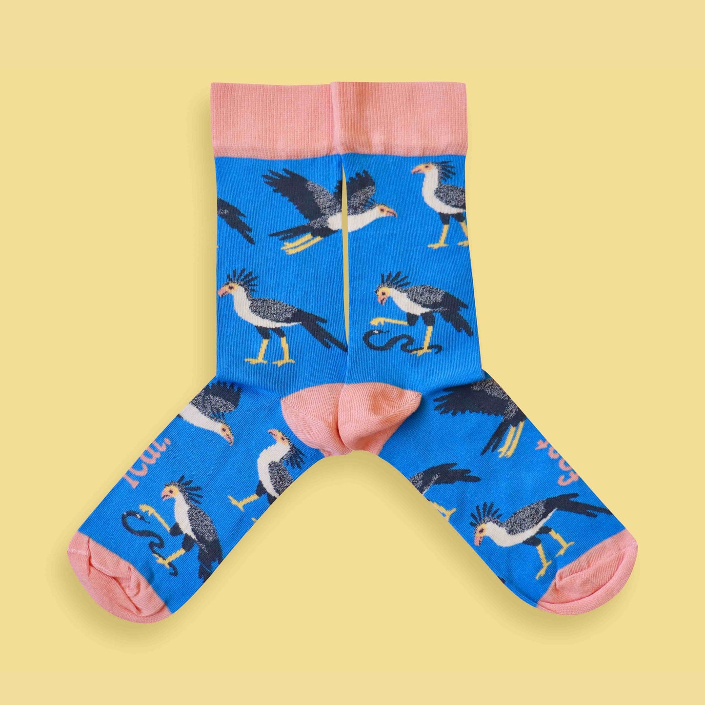 Secretary bird socks yellow background mirrored