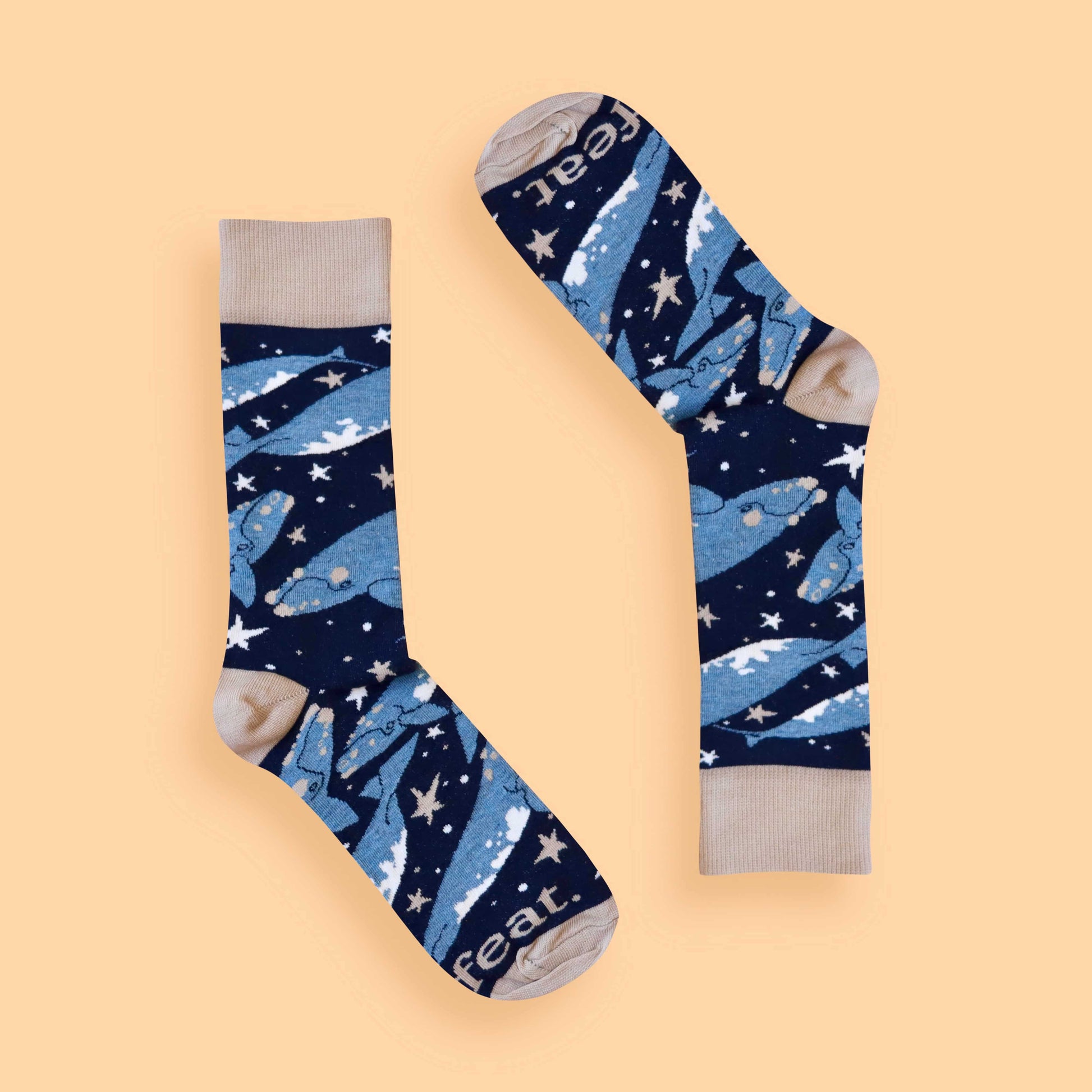 Whale socks peach background inverted
